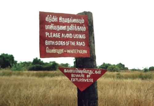 Roadside sign: Beware of landmines